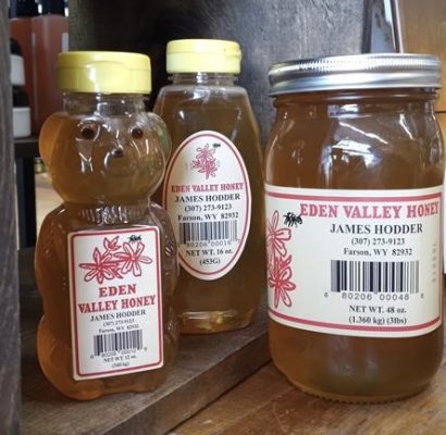 A honey bear, a squeeze bottle and a large jar of Eden Valley Honey with James Hodder's label